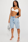 https://cdn.shopify.com/s/files/1/0293/9277/products/02-23-23Studio1_ID_M_14-11-13_27_FNSDEVSS2304_LightWash_0653_JB.jpg?v=1677785007