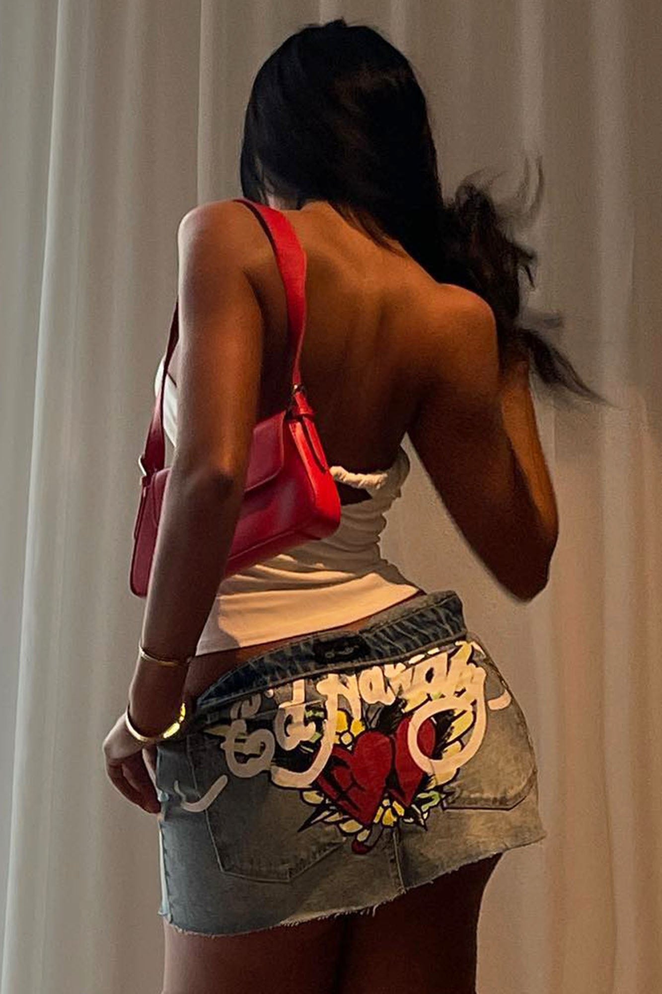 https://cdn.shopify.com/s/files/1/0293/9277/files/EdHardySkullDenimMiniSkirt-LightWash_MER.jpg?v=1714674566
